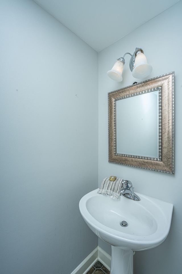 bathroom featuring tile patterned flooring and sink