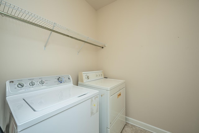 laundry room with separate washer and dryer