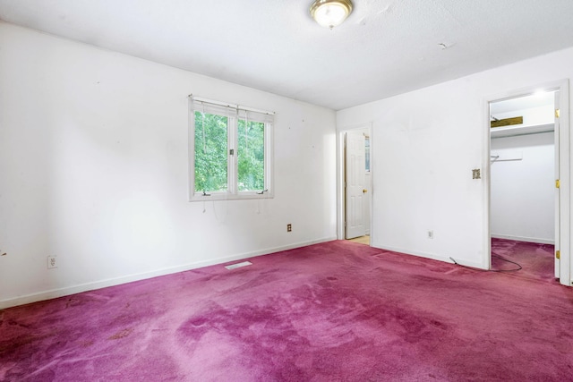 unfurnished bedroom featuring carpet