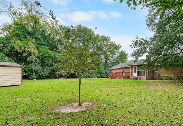 view of yard featuring a wooden deck