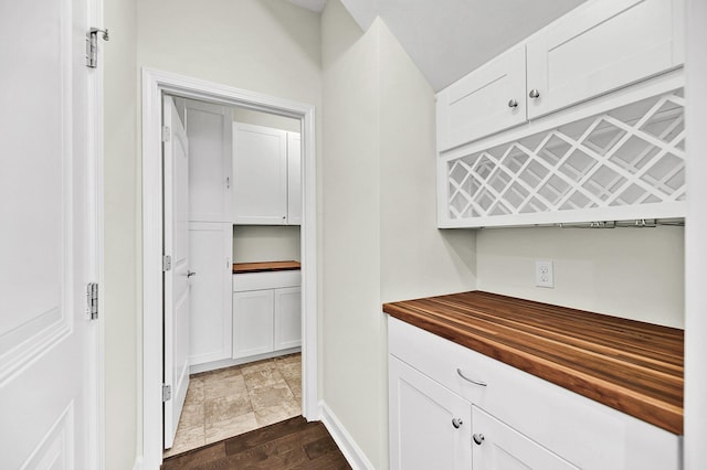 interior space featuring baseboards