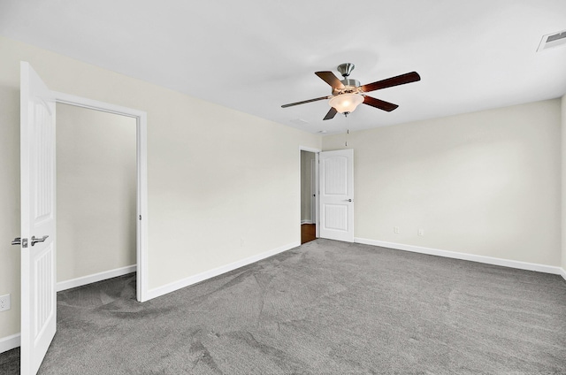 unfurnished bedroom with visible vents, a ceiling fan, carpet flooring, and baseboards