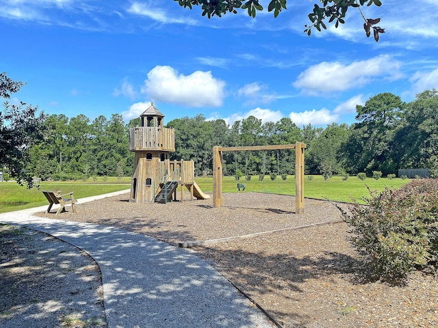 communal playground featuring a yard