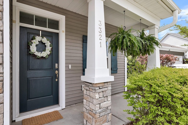 doorway to property with a porch