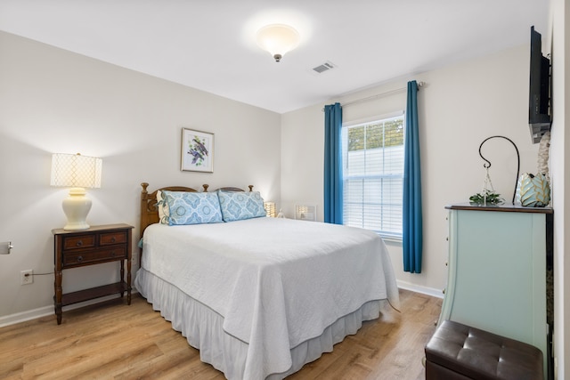 bedroom with light wood-type flooring