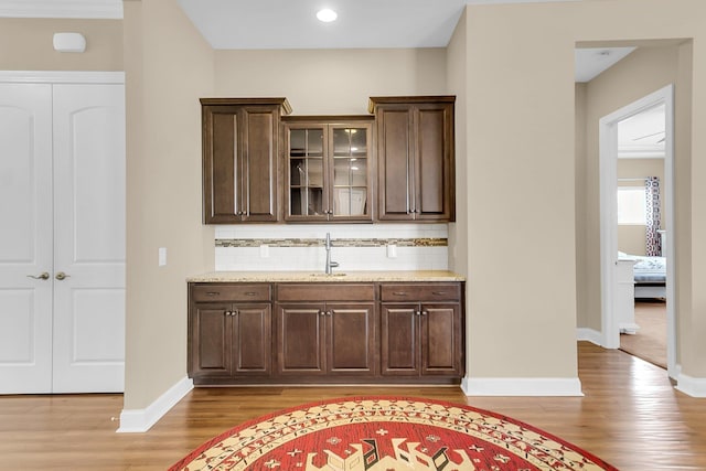522 Tidewater Chase Ln, Summerville, SC 29486 - bar featuring light wood-style floors, a sink, baseboards, and tasteful backsplash
