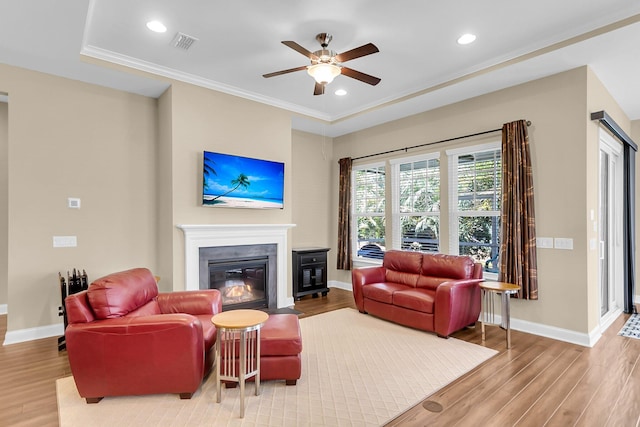 522 Tidewater Chase Ln, Summerville, SC 29486 - living area featuring a ceiling fan, baseboards, a glass covered fireplace, and wood finished floors