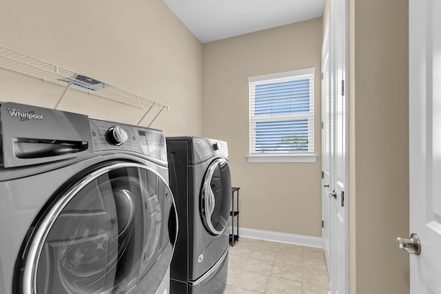 522 Tidewater Chase Ln, Summerville, SC 29486 - laundry area featuring baseboards, laundry area, washing machine and dryer, and light tile patterned flooring