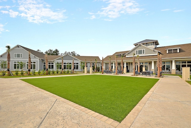 522 Tidewater Chase Ln, Summerville, SC 29486 - rear view of house featuring a patio, board and batten siding, and a lawn