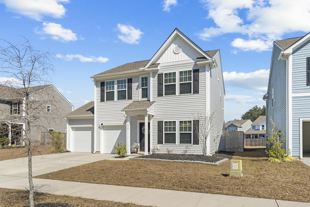 view of front facade featuring a shingled roof, concrete driveway, an attached garage, fence, and board and batten siding