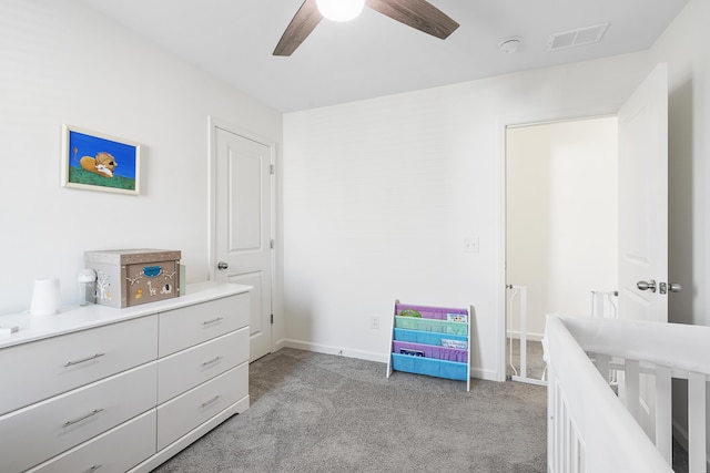 bedroom with a ceiling fan, light carpet, visible vents, and baseboards