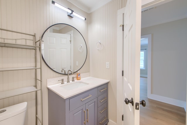 208 State St, Walterboro, SC 29488 - half bath featuring toilet, wood finished floors, vanity, and baseboards