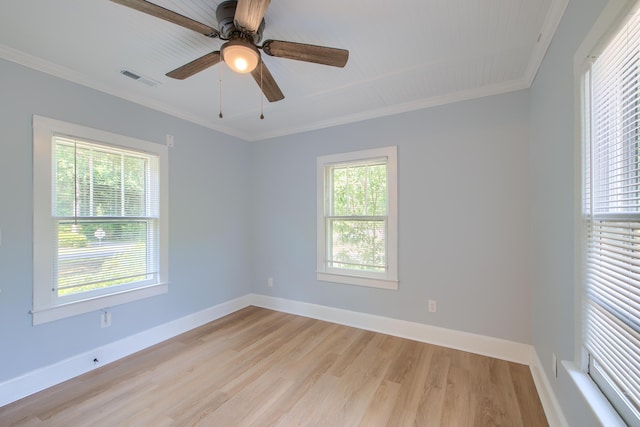 208 State St, Walterboro, SC 29488 - spare room featuring plenty of natural light, light wood-type flooring, crown molding, ceiling fan, and baseboards
