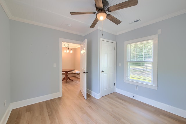 208 State St, Walterboro, SC 29488 - bedroom with light wood-style floors, ornamental molding, a chandelier, and baseboards