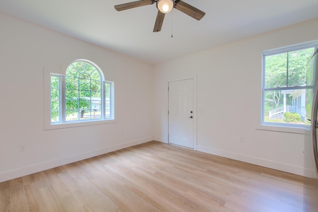 208 State St, Walterboro, SC 29488 - unfurnished room featuring plenty of natural light, light wood finished floors, a ceiling fan, and baseboards