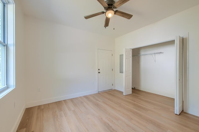 208 State St, Walterboro, SC 29488 - unfurnished bedroom with light wood-style flooring, baseboards, a closet, and ceiling fan