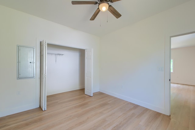 208 State St, Walterboro, SC 29488 - unfurnished bedroom with light wood-style flooring, electric panel, a closet, ceiling fan, and baseboards