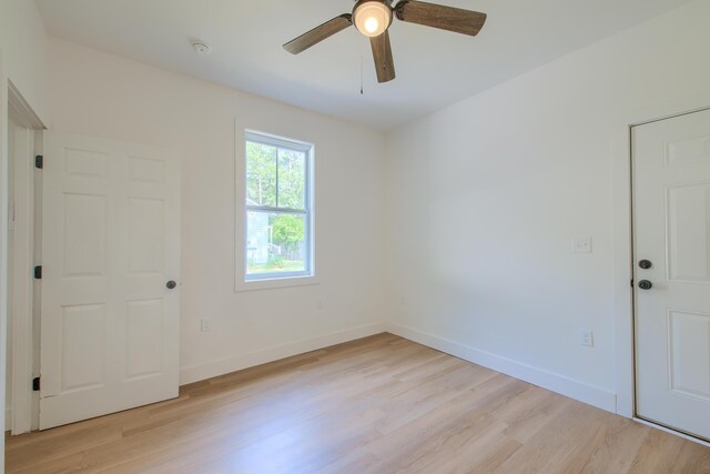 208 State St, Walterboro, SC 29488 - spare room with light wood finished floors, ceiling fan, baseboards, and a smoke detector