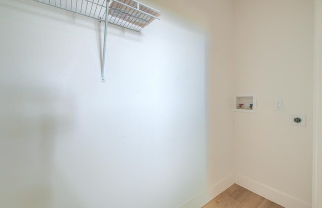 208 State St, Walterboro, SC 29488 - laundry room with electric dryer hookup, baseboards, hookup for a washing machine, and light wood-type flooring