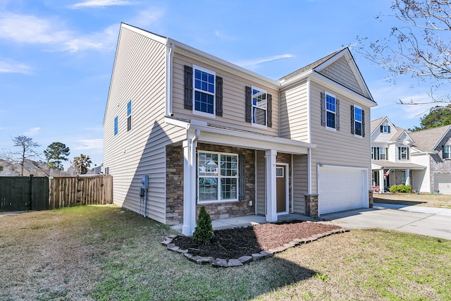 view of front of home with stone siding, fence, concrete driveway, a front yard, and an attached garage