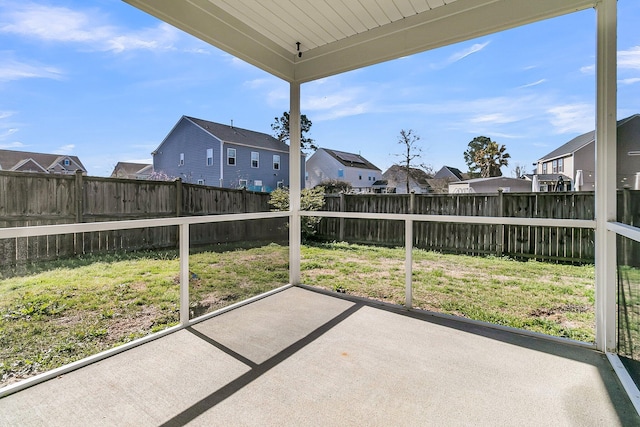 unfurnished sunroom featuring a residential view