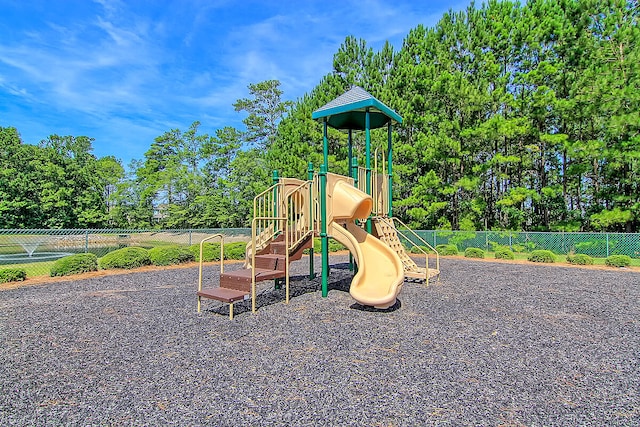 community jungle gym featuring fence