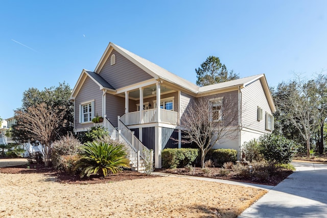 view of front facade featuring ceiling fan and covered porch