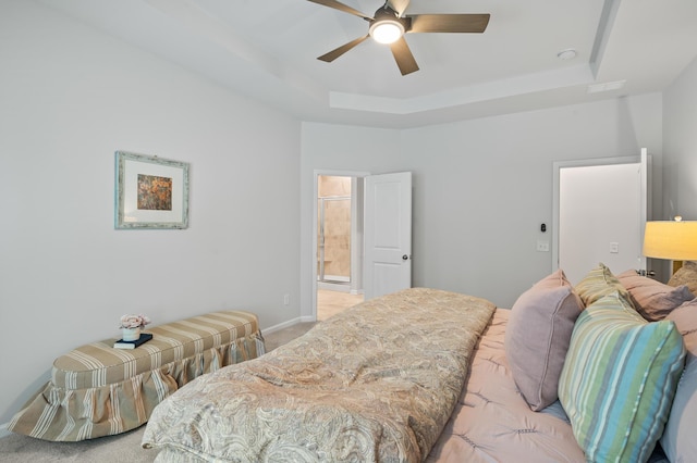 209 Country Gate Ln, Summerville, SC 29485 - bedroom with a tray ceiling, light colored carpet, connected bathroom, baseboards, and ceiling fan
