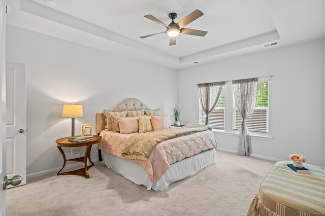 209 Country Gate Ln, Summerville, SC 29485 - bedroom with a tray ceiling, light carpet, baseboards, and ceiling fan
