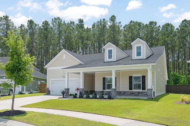 209 Country Gate Ln, Summerville, SC 29485 - view of front of property with covered porch, stone siding, concrete driveway, a garage, and roof with shingles