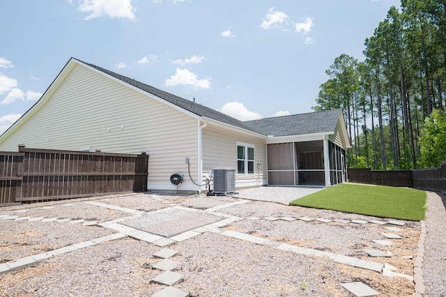 209 Country Gate Ln, Summerville, SC 29485 - back of property featuring a sunroom, cooling unit, roof with shingles, and a patio area