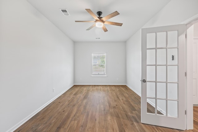 209 Country Gate Ln, Summerville, SC 29485 - spare room with ceiling fan, wood-type flooring, and baseboards