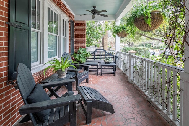 balcony with a porch and ceiling fan