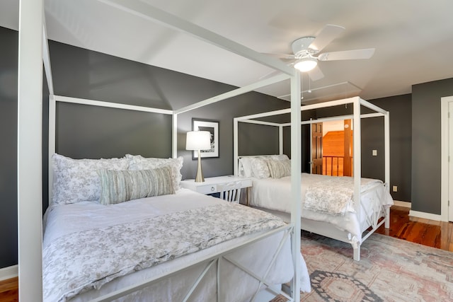 bedroom featuring hardwood / wood-style flooring and ceiling fan