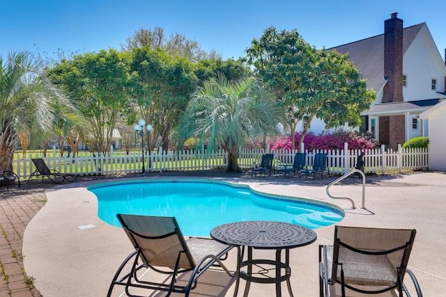 view of swimming pool featuring a patio area