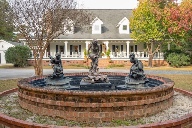 new england style home with a porch