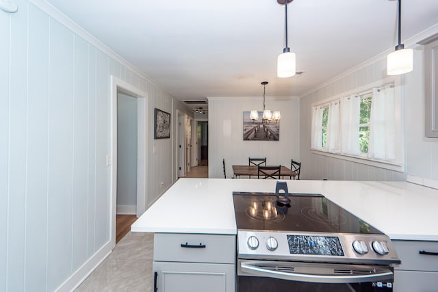 kitchen with pendant lighting, an inviting chandelier, ornamental molding, and electric stove