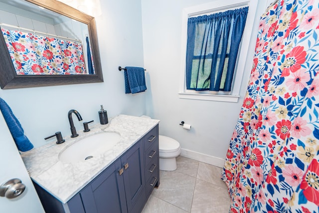 bathroom with tile patterned flooring, vanity, toilet, and curtained shower