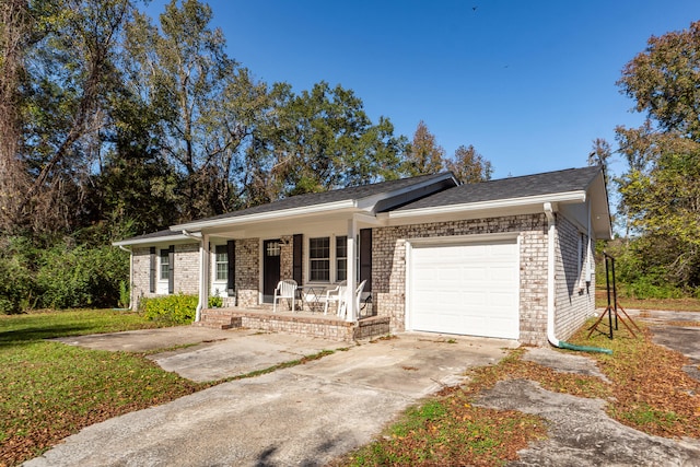 single story home featuring a porch and a garage