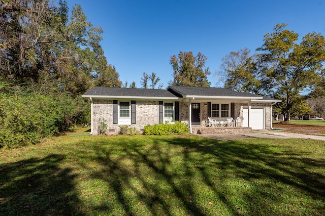 single story home with a front lawn, covered porch, and a garage