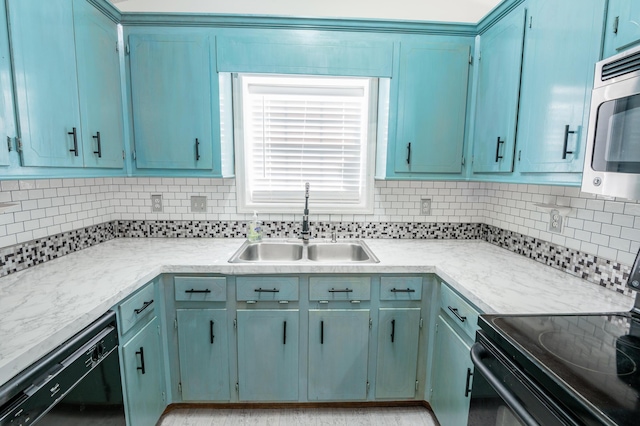 kitchen with decorative backsplash, sink, and black appliances