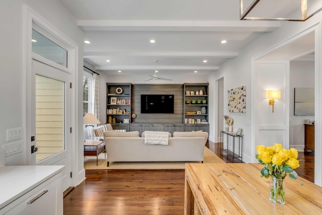 living room featuring beamed ceiling, recessed lighting, ceiling fan, and dark wood-style floors