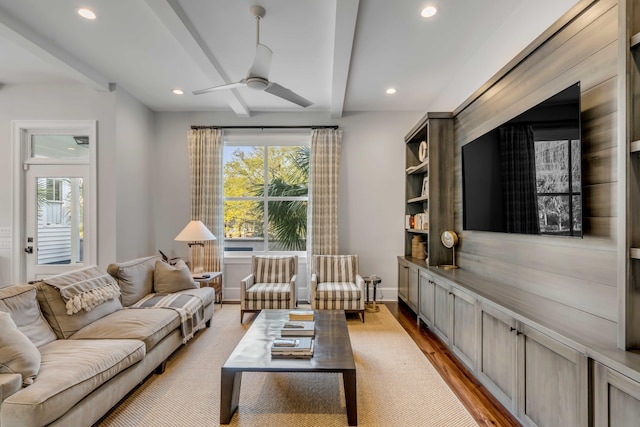 living room with light wood finished floors, beam ceiling, a ceiling fan, and recessed lighting