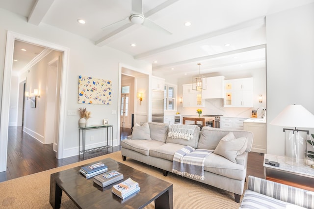living area featuring recessed lighting, baseboards, ceiling fan, dark wood-type flooring, and beamed ceiling