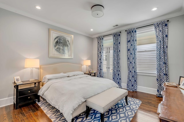 bedroom featuring baseboards, ornamental molding, recessed lighting, and wood finished floors