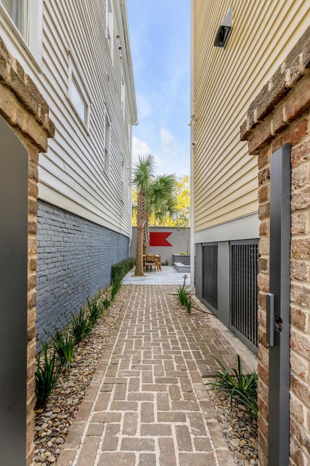 view of side of property featuring a patio