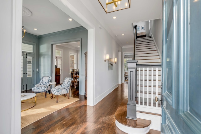 entrance foyer with recessed lighting, baseboards, ornamental molding, stairs, and wood finished floors
