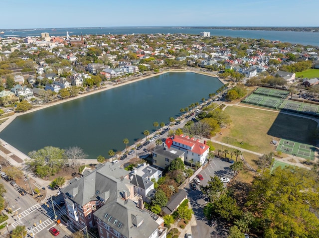 drone / aerial view featuring a water view and a residential view