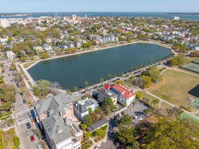 drone / aerial view featuring a water view and a residential view