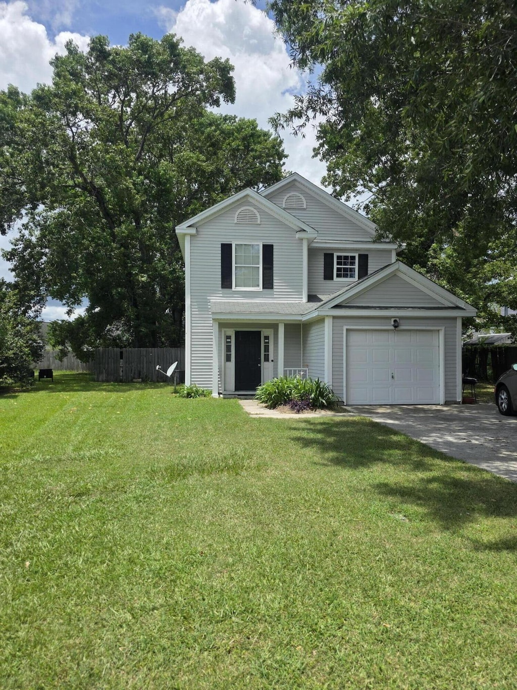 5133 Southside Dr, North Charleston, SC 29418 - traditional-style house with concrete driveway and an attached garage